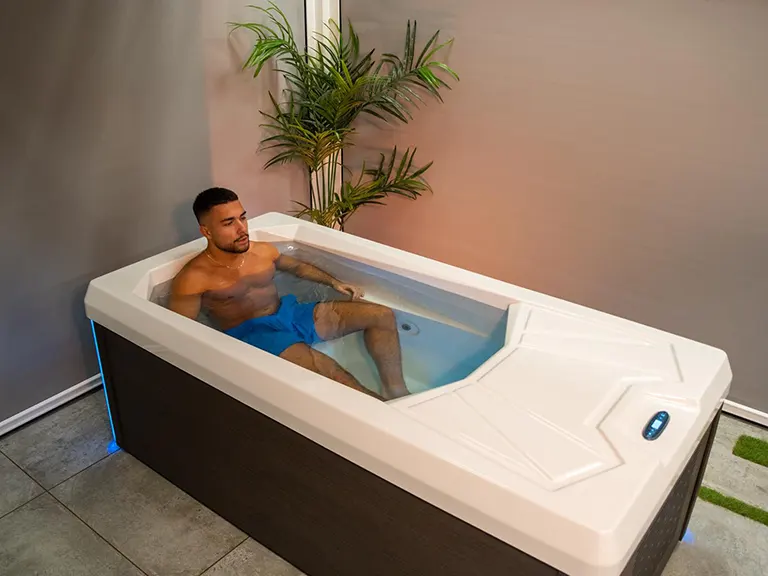 Man relaxing in a Chill Tubs Pro cold plunge tub