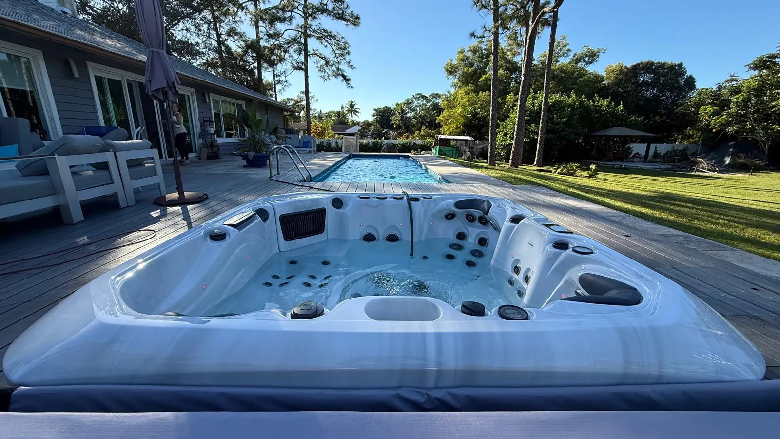 Platinum Palma recessed in the wood deck beside the pool
