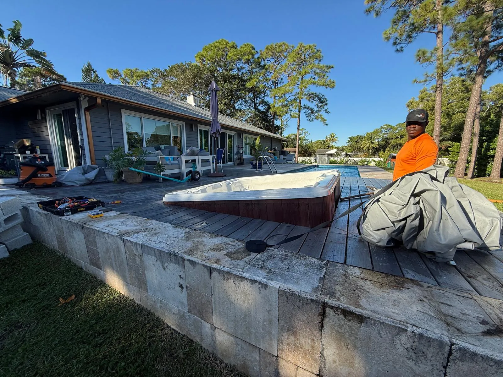 Old hot tub lifted out of the deck