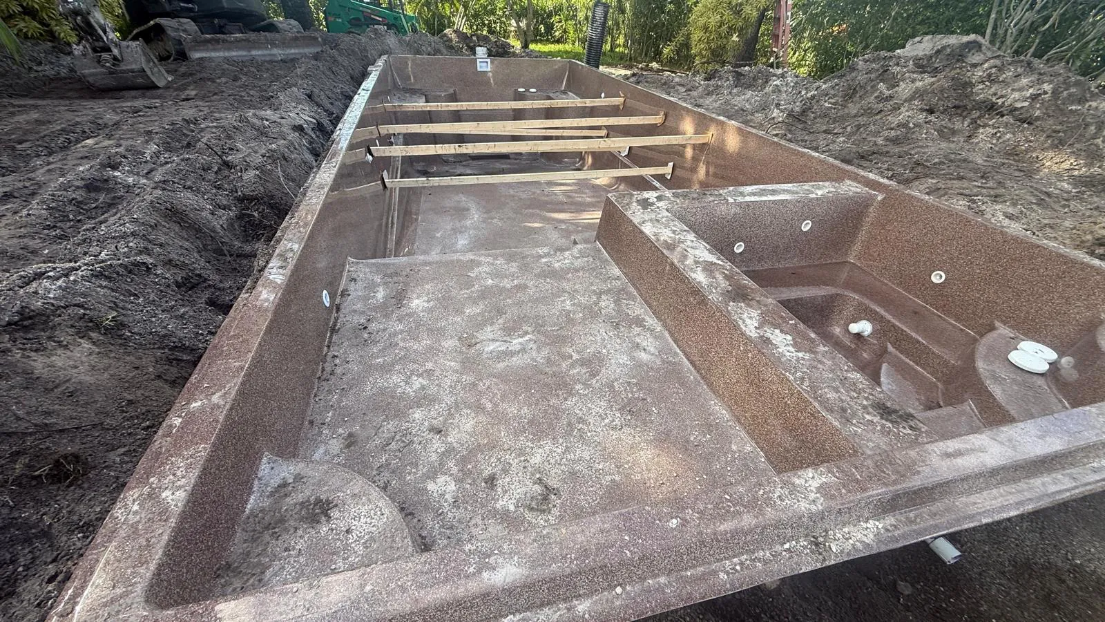 Astoria 14 shell braced across the top during plumbing and backfill