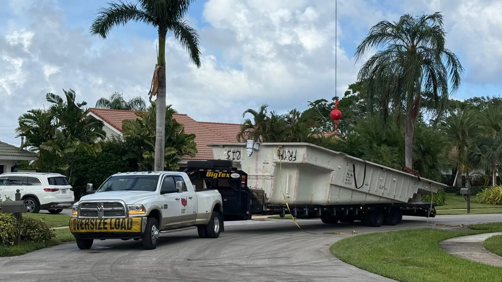 Latham Astoria 14 pool shell arriving on a trailer