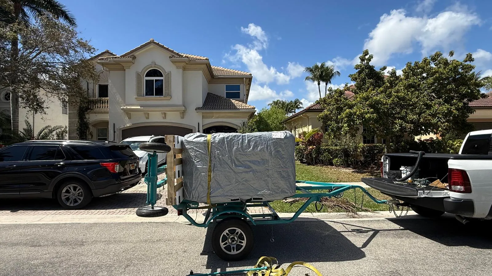 The same hot tub arriving wrapped on a spa trailer