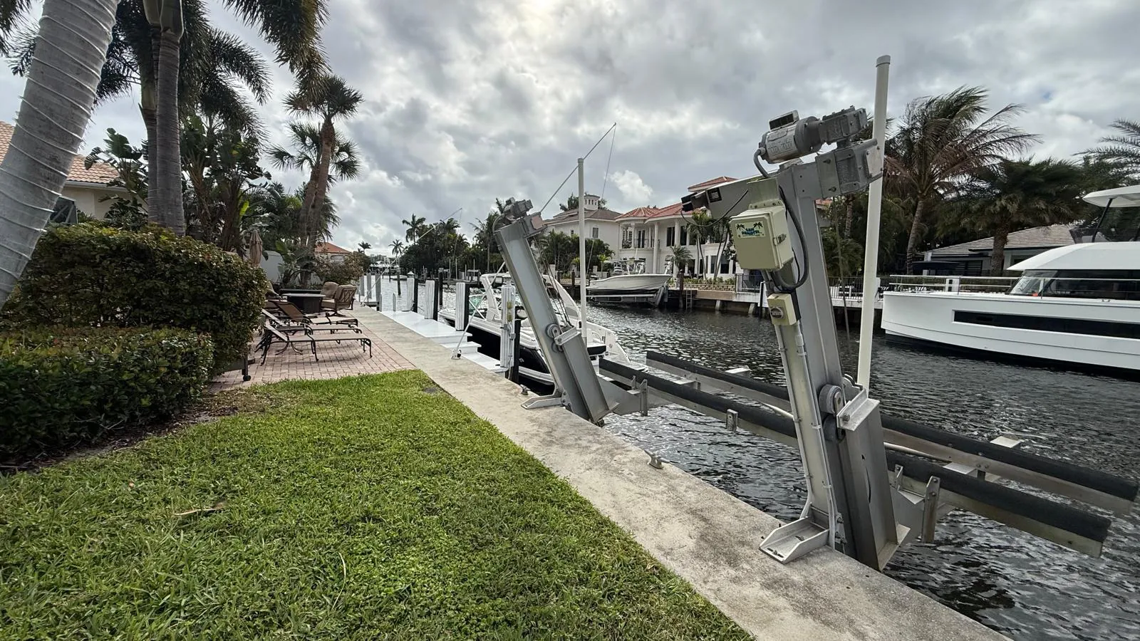 The canal and boat lift behind the home