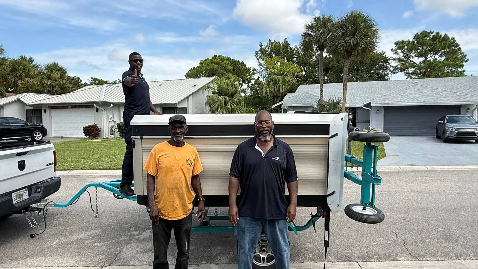 The same hot tub on the spa trailer with the crew