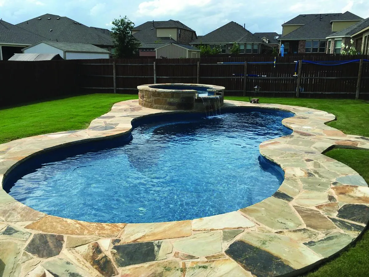 Latham Axiom 14 fiberglass pool installed in a backyard
