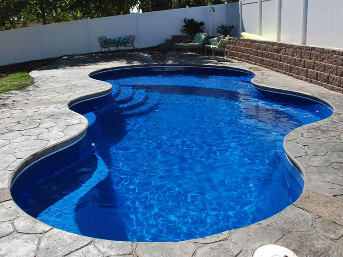 Latham Axiom fiberglass pool with paver decking