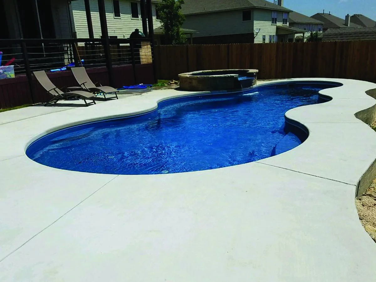 Latham Axiom 16 fiberglass pool installed in a backyard