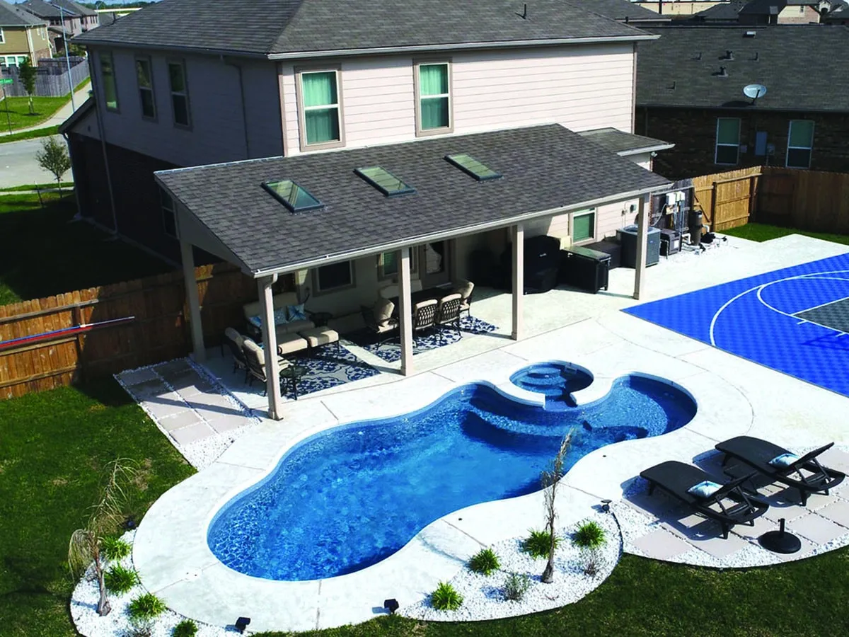 Latham Bermuda 14 Deluxe fiberglass pool installed in a backyard