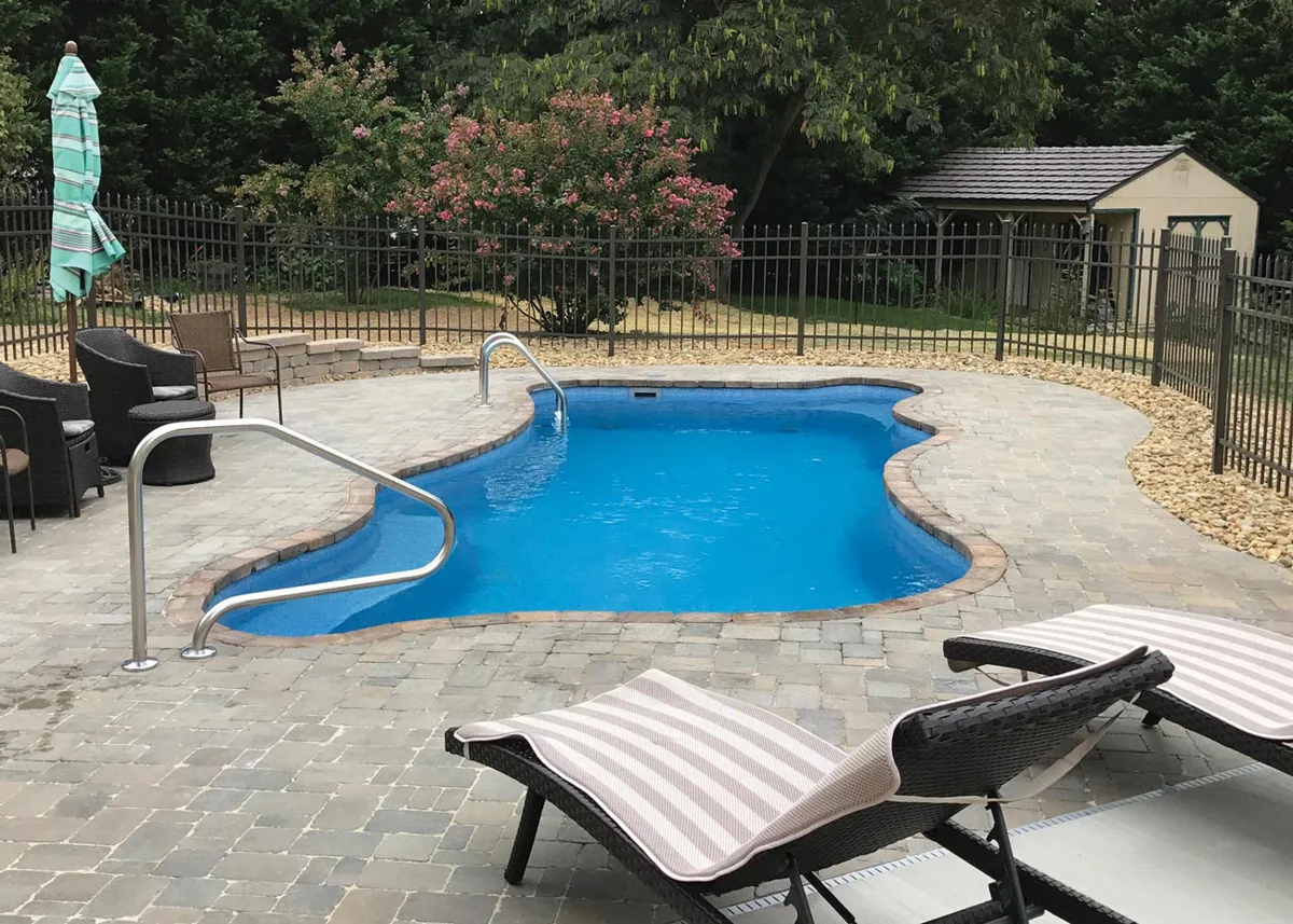 Latham Cape Cod 12 fiberglass pool installed in a backyard