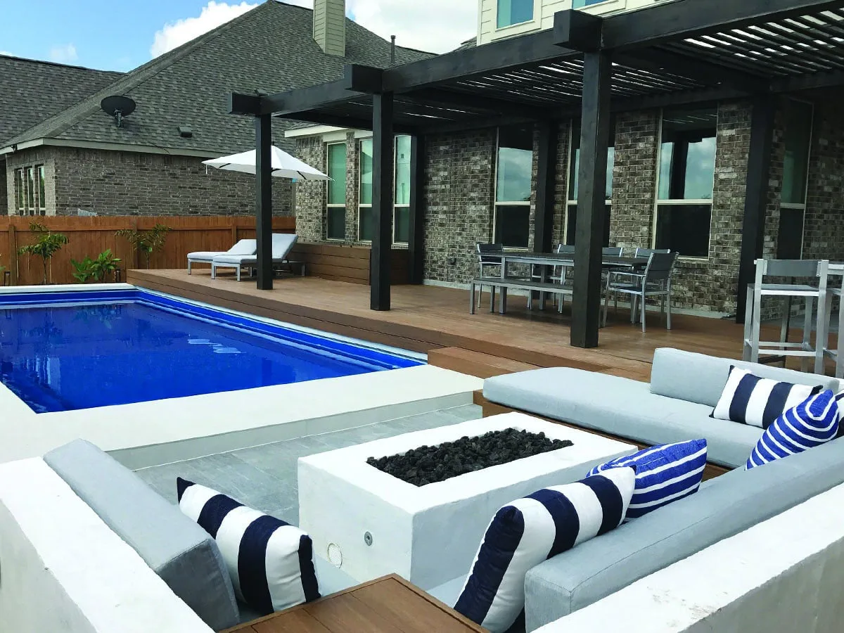 Latham Claremont fiberglass pool installed in a backyard