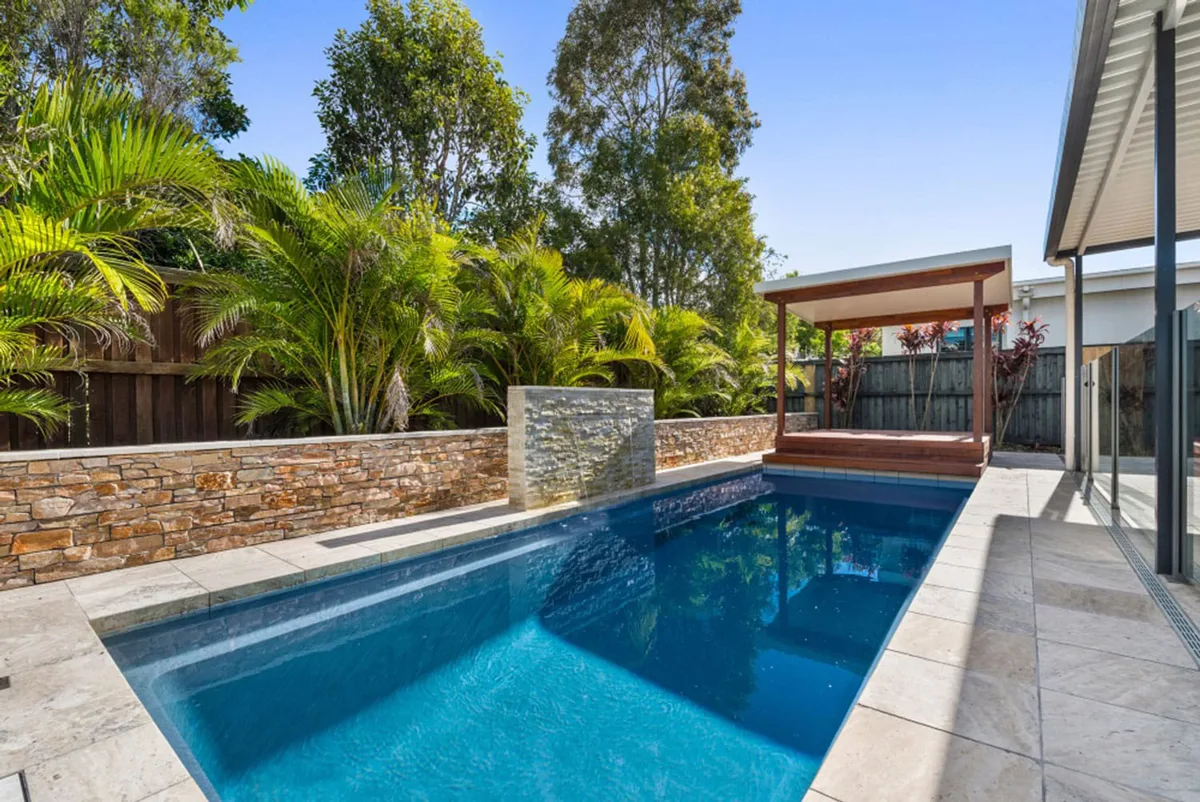 Latham Enchantment 9.24 fiberglass pool installed in a backyard