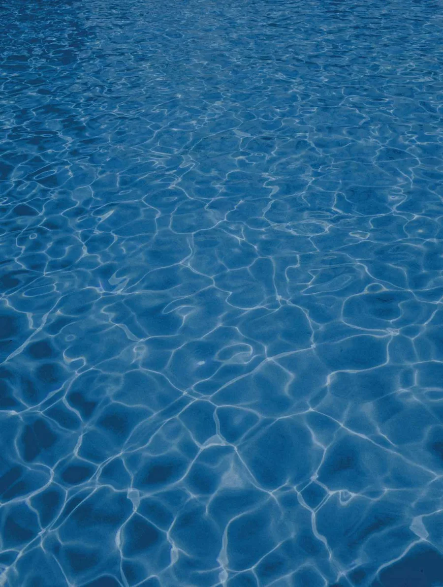 Pool water over a Latham Night Sky fiberglass shell