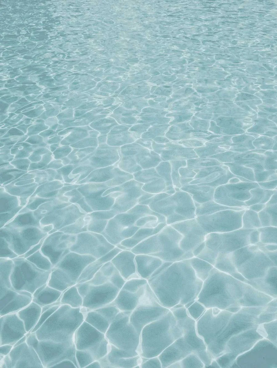 Pool water over a Latham Pearl White fiberglass shell