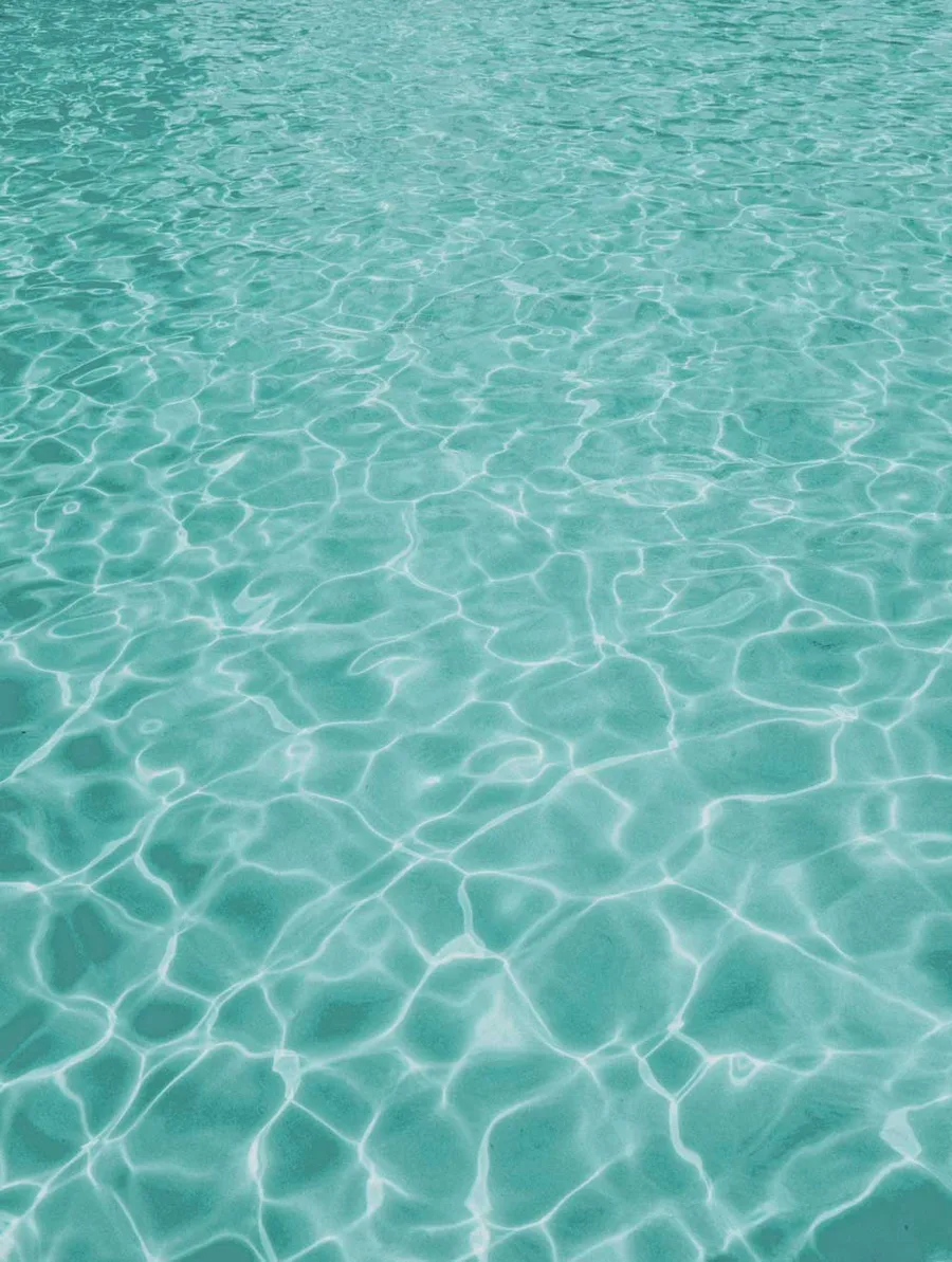 Pool water over a Latham Shale Gray fiberglass shell