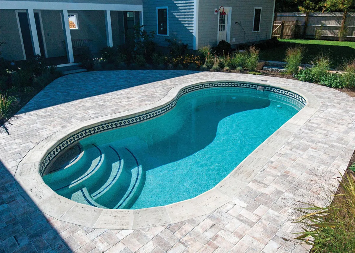 Latham Jamaica 12 fiberglass pool installed in a backyard