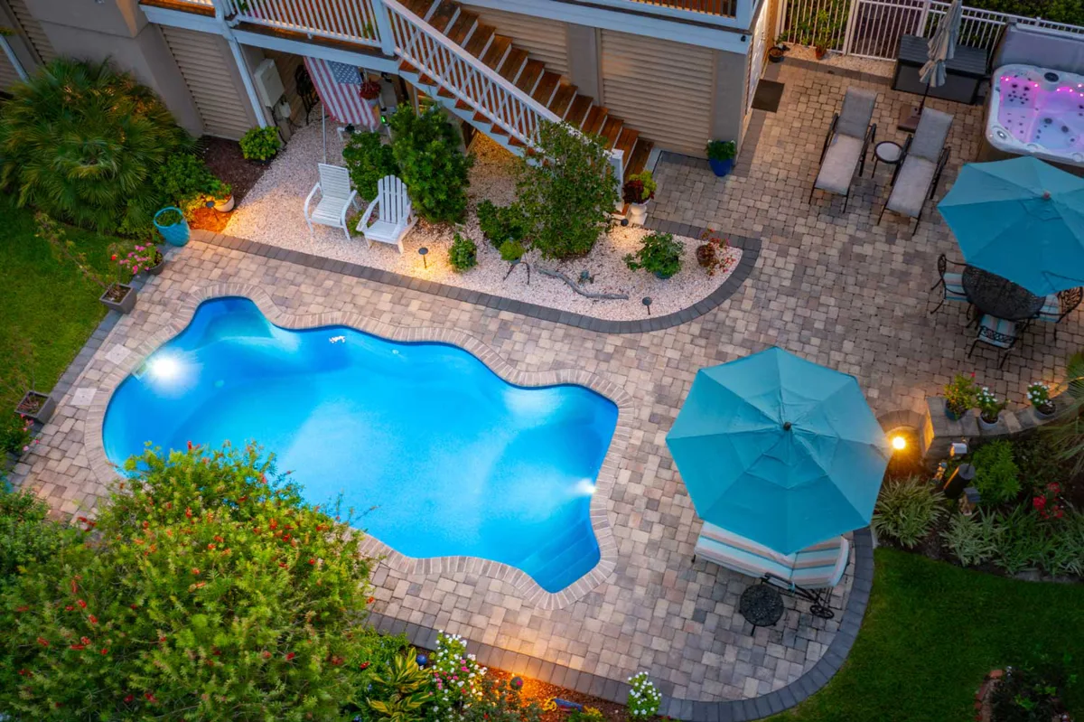 Latham Key West fiberglass pool installed in a backyard