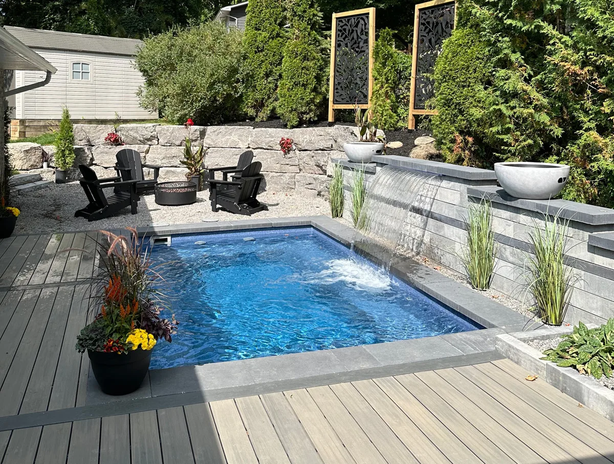 Latham Milan 10.16 fiberglass pool installed in a backyard