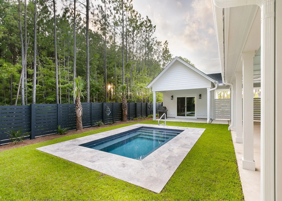 Latham Milan 8.14 fiberglass pool installed in a backyard