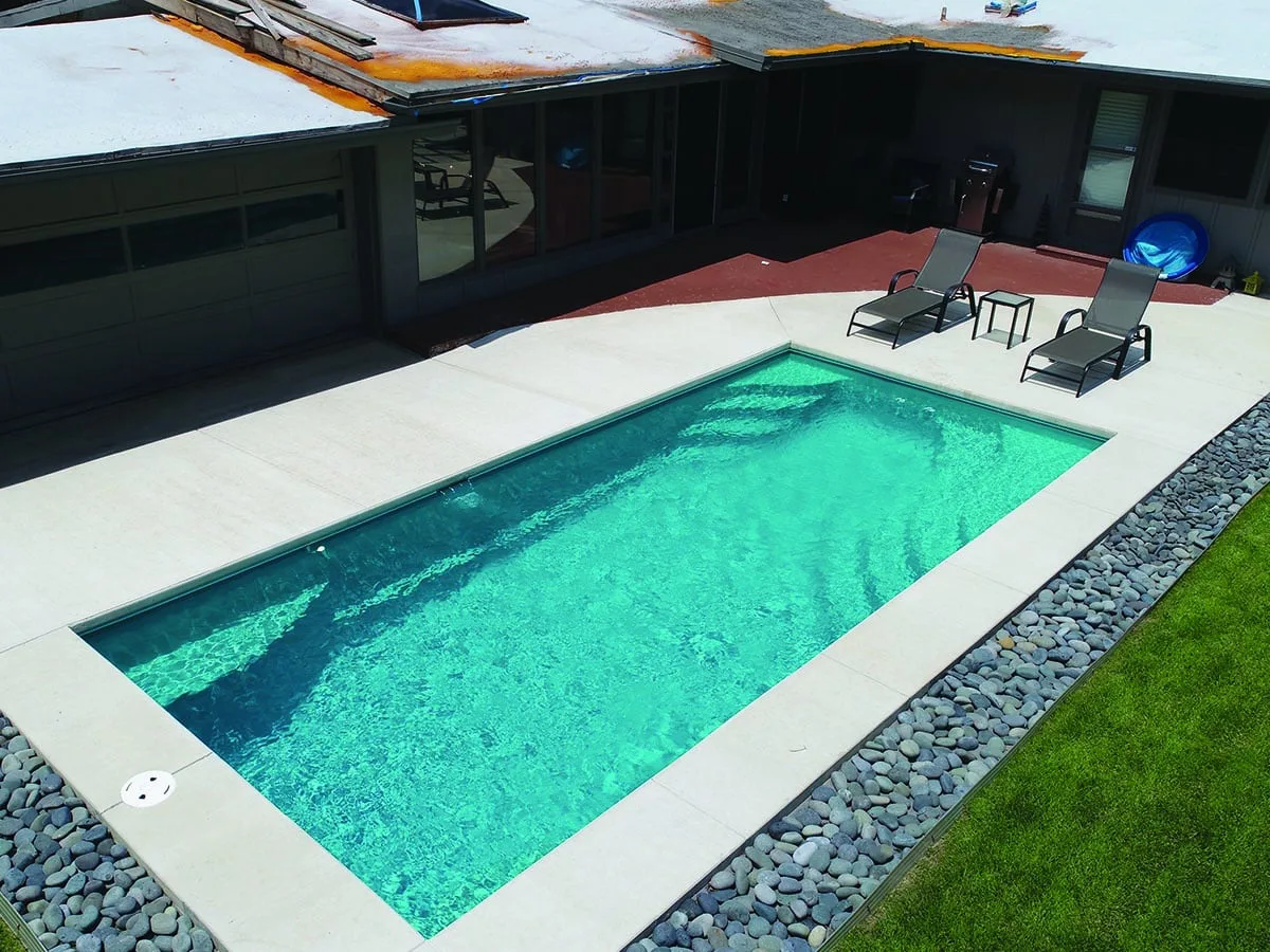 Latham Olympia 12 fiberglass pool installed in a backyard