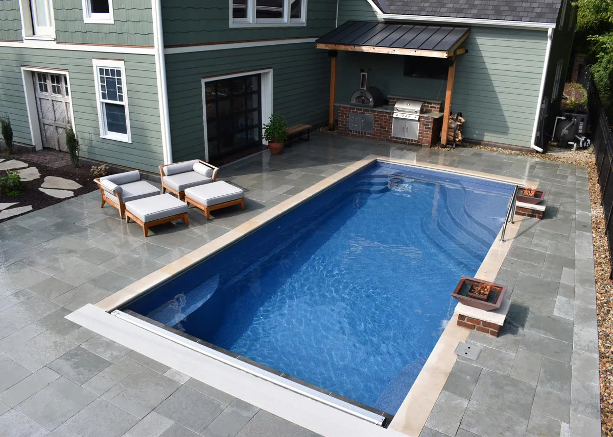Latham Olympia 14 fiberglass pool installed in a backyard