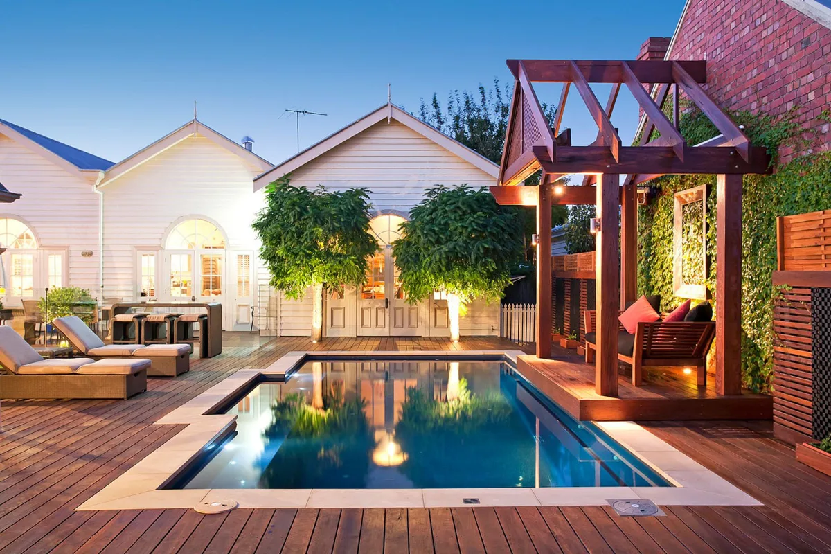 Latham Tuscan 11.20 fiberglass pool installed in a backyard