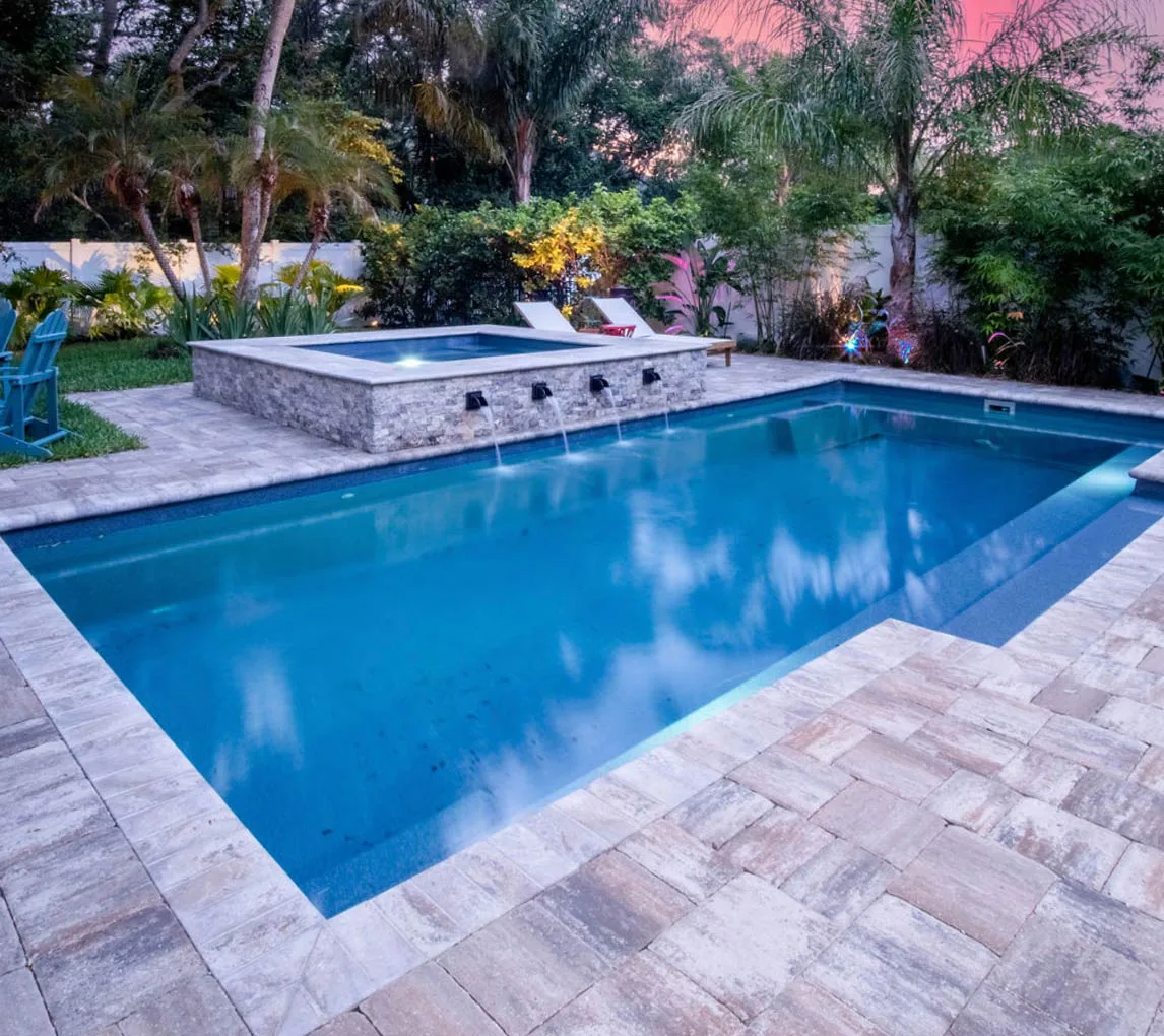Latham Tuscan 14.27 fiberglass pool installed in a backyard