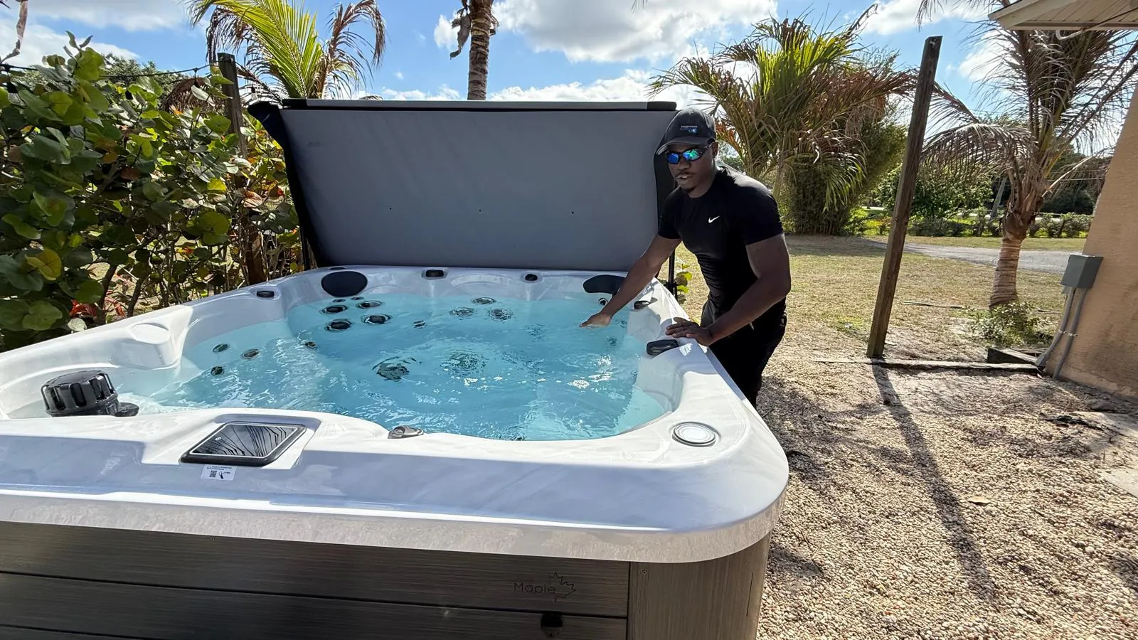 Crew checking the water of a new hot tub in Loxahatchee