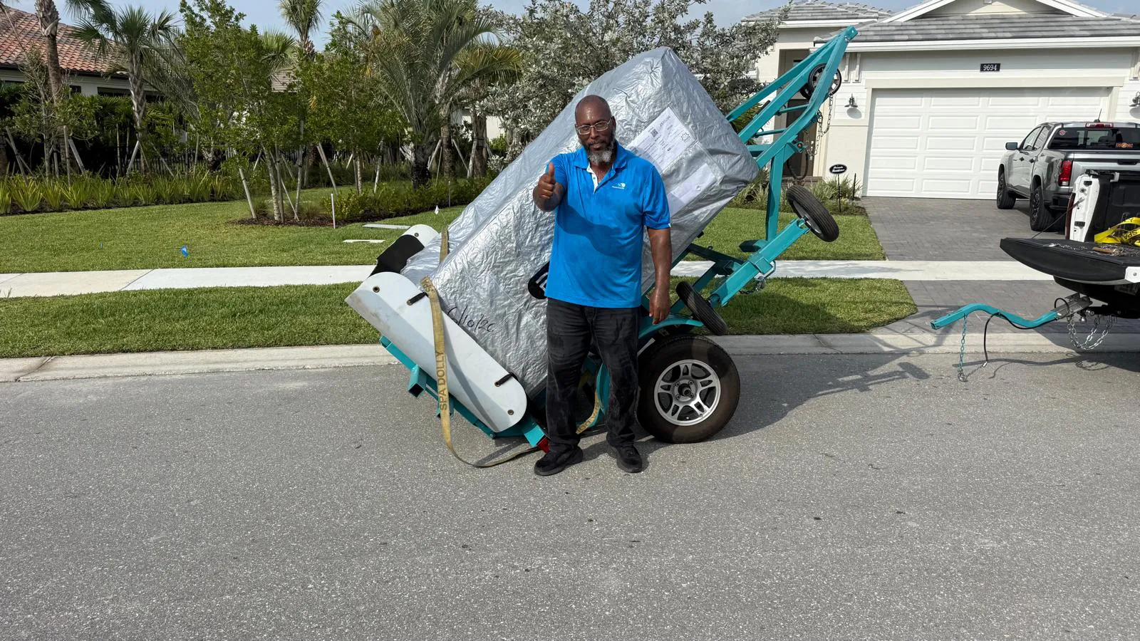 Hot tub tilted off a delivery trailer in Palm Beach Gardens