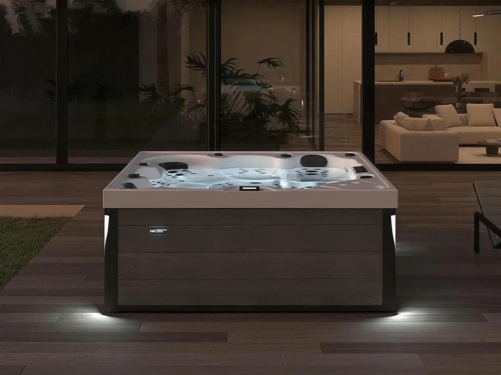 Platinum Spas Onyx hot tub lit up on a deck at night