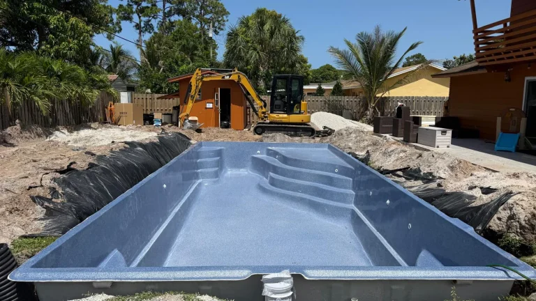 Fiberglass pool shell with built-in steps and bench