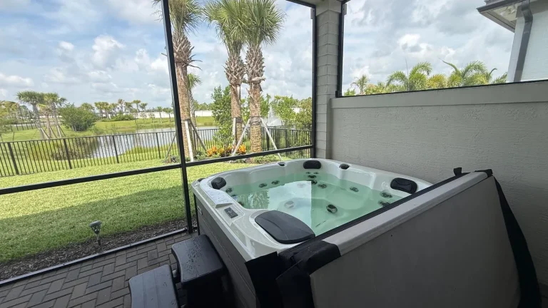 Hot tub in the corner of a screened patio