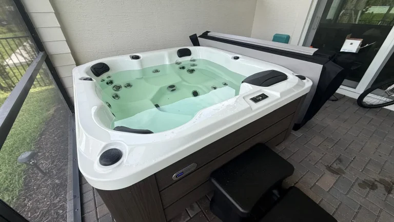 Hot tub filled and running on a covered patio