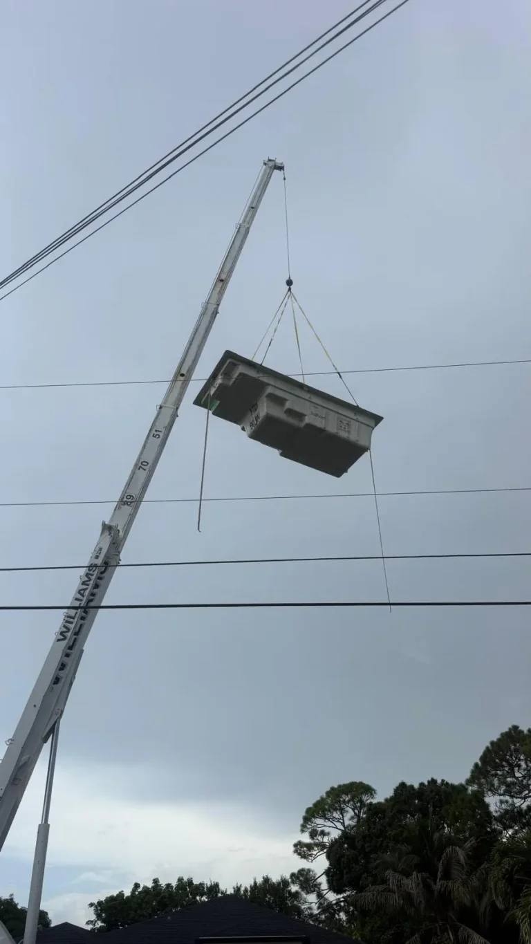 Spa hanging from the crane during a lift
