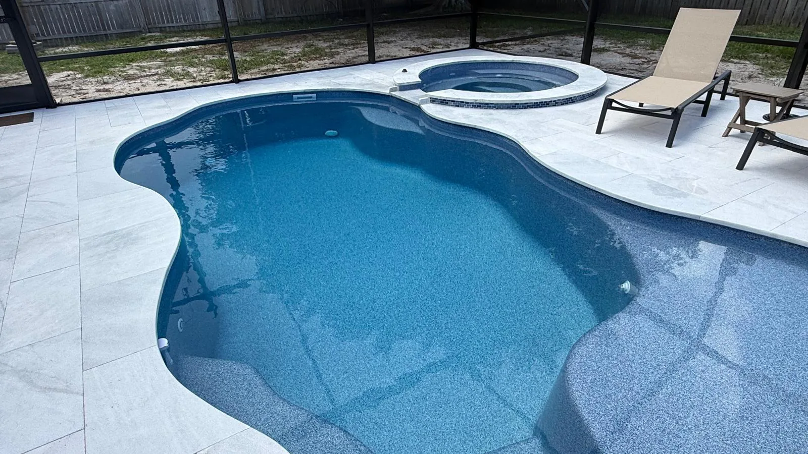 Finished sapphire blue Pleasant Cove pool with Shasta spillover spa in Stuart, FL