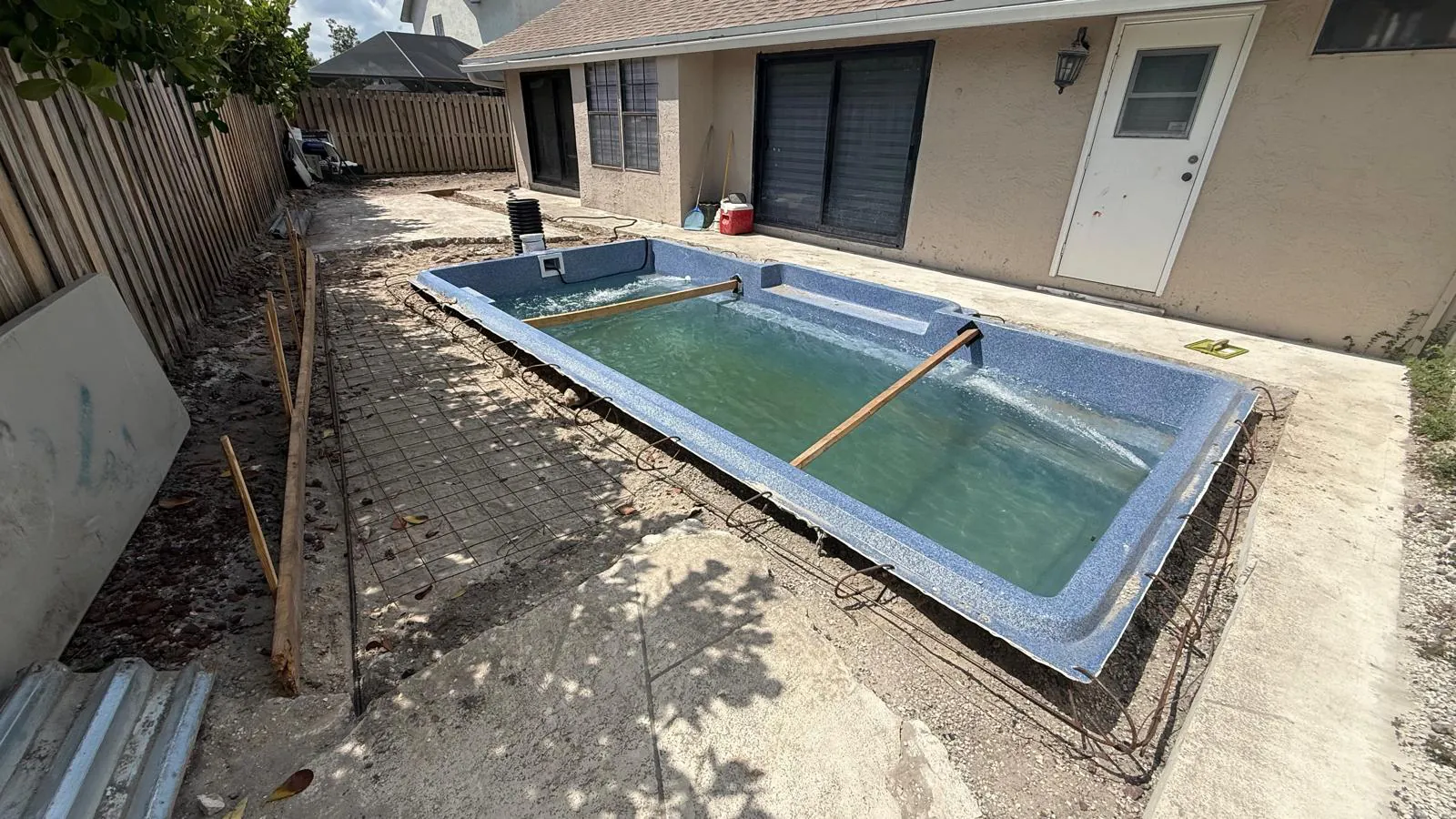Steel and forms set around the rim of the pool