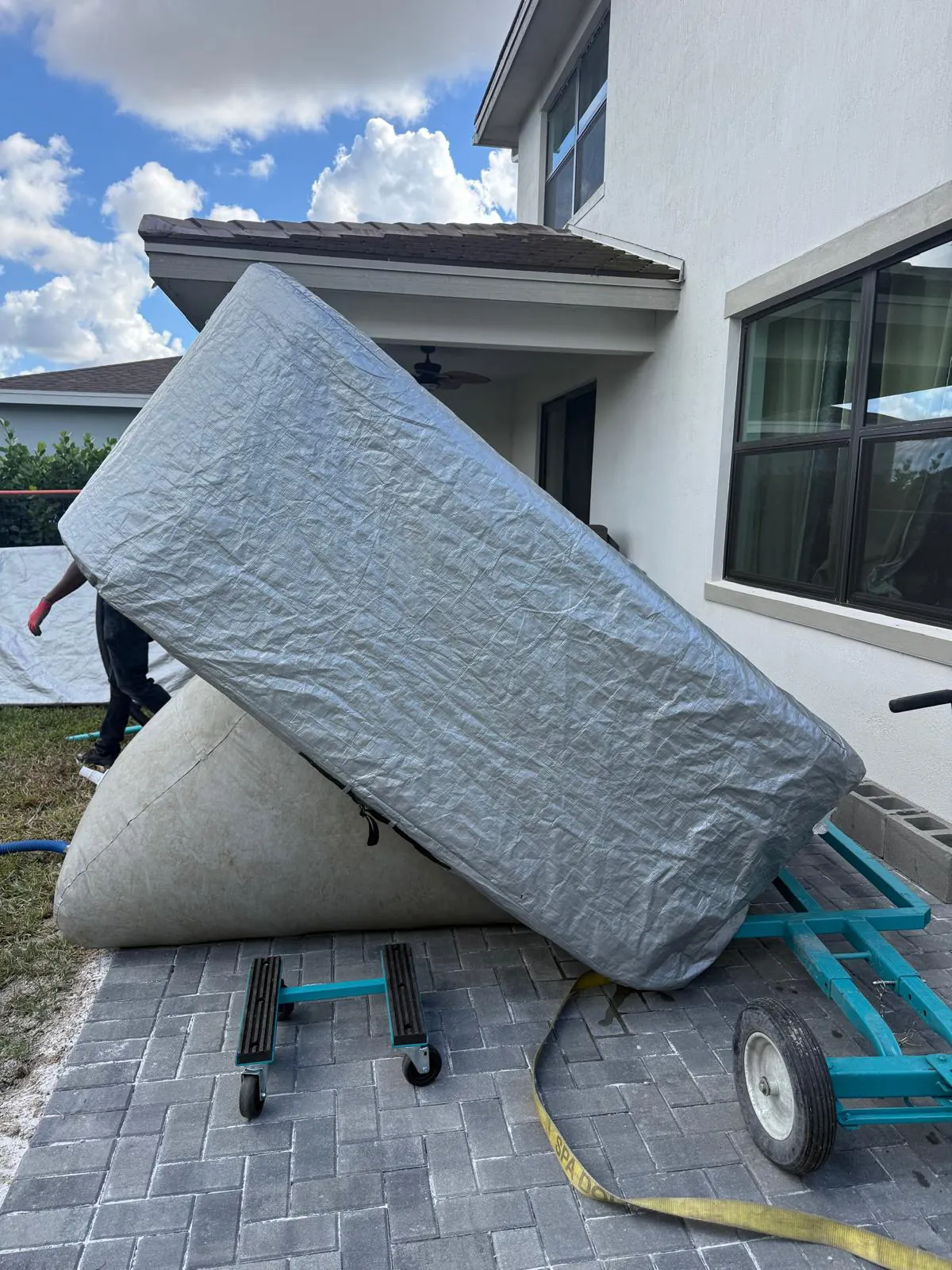 Hot tub being lowered onto an air cushion
