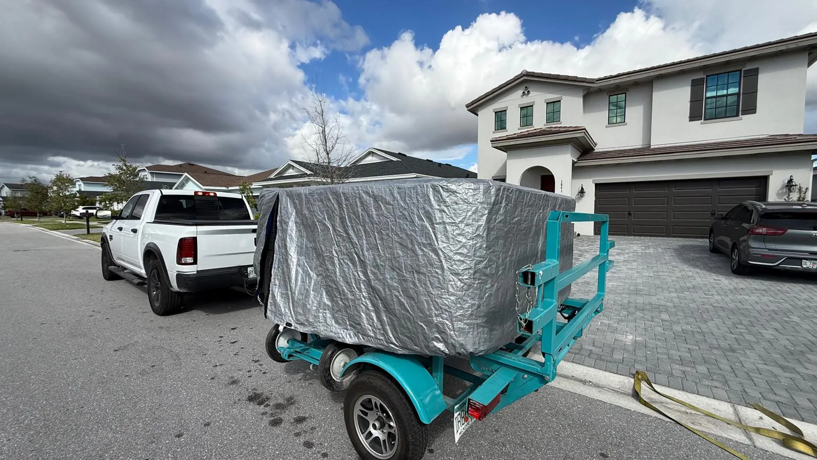 The same hot tub arriving wrapped on a spa trailer
