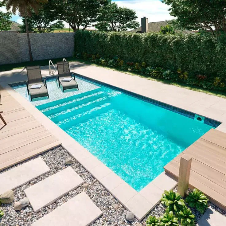 X-Pools California fiberglass pool with wide entry steps and a wood deck