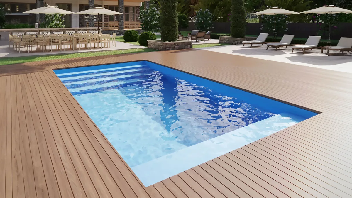 X-Pools Miami fiberglass pool with a wood deck and outdoor seating