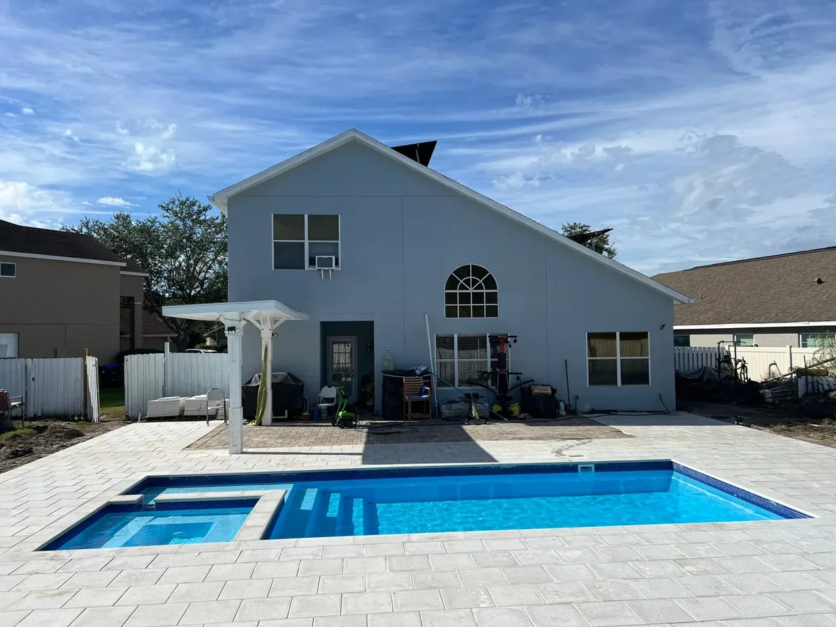 X-Pools X-Line 9 fiberglass pool with integrated spa in a residential backyard